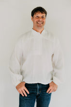Load image into Gallery viewer, Man modeling View B a simple white cotton shirting.  He is wearing denim jeans and standing in front of a white backdrop.
