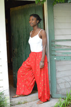 Load image into Gallery viewer, Young African American woman standing in a doorway wearing red 119 Sarouelle pants view A (Turkish Pants)
