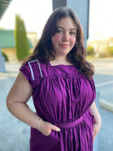 Load image into Gallery viewer, Close up of young woman wearing a purple sleeveless dress with some embellished shoulder yoke.

