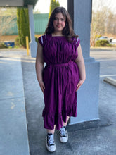 Load image into Gallery viewer, Young woman wearing a purple sleeveless dress with some embellished shoulder yoke.
