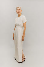 Load image into Gallery viewer, Photo if woman in modified 122.  Neckline is without mandarin collar and front closure is without decorative frogs.
