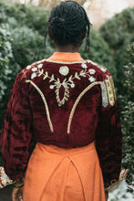 Load image into Gallery viewer, Back view of 124.  This is an original garment made in traditional velvet with beading and braid trim

