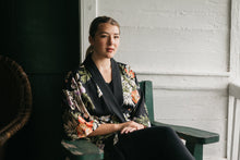 Load image into Gallery viewer, Young woman sitting outdoors wearing floral haori jacket
