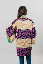 Load image into Gallery viewer, Asian woman wearing a purple, black, green, and gold printed Haori - back view with white back ground.
