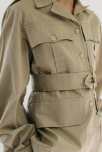 Load image into Gallery viewer, Close up photo of Jacket front/side view.  Shows pocket, collar, buttons, and belt details.
