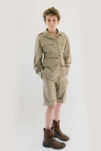 Load image into Gallery viewer, Boy wearing 130 Australian Bush Outfit  Jacket and shorts.  Standing in front of white backdrop with hands in shorts pockets.
