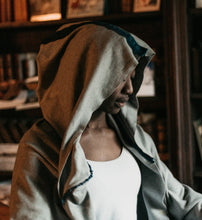 Load image into Gallery viewer, Close up photo of woman wearing open front adaptation of Burnoose.  Photo highlights the hood.
