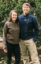 Load image into Gallery viewer, Man and woman standing together wearing a navy and brown Belgian Military Chef's Coats, respectively.  Outside by bushes.
