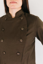 Load image into Gallery viewer, Close up of woman's brown chef's jacket.
