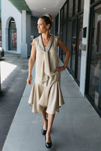 Load image into Gallery viewer, woman walking with hand on her hip in front of a building wearing pumps and 237 Tango Dress.
