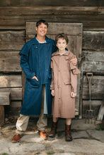 Load image into Gallery viewer, Man and boy wearing Drovers coats standing outside of a wooden building
