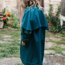 Load image into Gallery viewer, Young girl wearing a blue Australian Drovers Coat. side and back views
