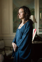 Load image into Gallery viewer, Photo of young woman standing in Michiyuki jacket in soft lit room.
