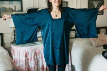 Load image into Gallery viewer, Photo of woman wearing Michiyuki.  She is standing facing camera with arms extended and raised to show full sleeves of the jacket.
