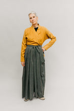 Load image into Gallery viewer, Photo of woman wearing Hakama pants.  Standing in front of a studio backdrop.  Left hand on hip.
