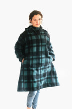 Load image into Gallery viewer, Photo of young woman standing with hands in pockets of oversized fleece Siberian Parka.
