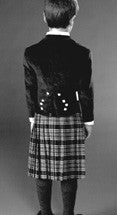 Load image into Gallery viewer, Black and white photo of back view of Prince Charlie Jacket and Kilt on young boy.
