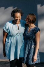 Load image into Gallery viewer, Two women African American and White laughing together wearing the Ghanaian Smock.
