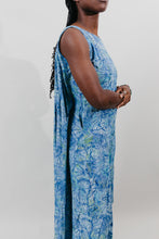 Load image into Gallery viewer, Side view of the sleeveless muumuu with the back tucked together inside.  Close up of side.
