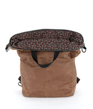 Load image into Gallery viewer, The Vega bag is fully lined. This waxed canvas bag is lined with liberty-style quilting cotton.
