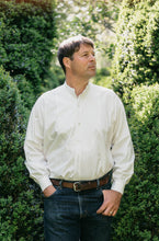 Load image into Gallery viewer, Man standing outside in victorian shirt tucked in and looking to the distance.
