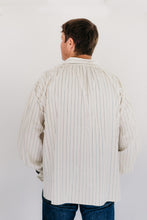 Load image into Gallery viewer, Man standing in front of a white studio backdrop wearing 204 Missouri River Boatman's Shirt.
