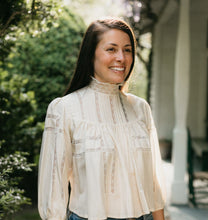 Load image into Gallery viewer, Brunette woman smiling looking to the right,  surrounded by greenery wearing 205 Gibson Girl Blouse.
