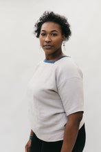 Load image into Gallery viewer, side view of African American woman wearing the square neck 211 Two Middies standing in front of a white studio backdrop.
