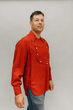 Load image into Gallery viewer, Man standing slightly turned to the side in front of a white studio backdrop wearing 212 Five Frontier Shirts View C with buttoned front bib.
