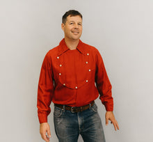 Load image into Gallery viewer, Man standing in front of a white studio backdrop wearing 212 Five Frontier Shirts View C with a buttoned bib shape in the front.
