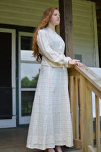 Load image into Gallery viewer, Young red head woman standing on a porch wearing 216 Schoolmistresses Shirtwaist and Skirt.

