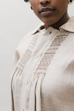 Load image into Gallery viewer, Close up of African American woman bust of 221 English Smock Frock, button opening and embroidery.
