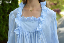 Load image into Gallery viewer, close up of front of blue night gown with ruffles at neckline.
