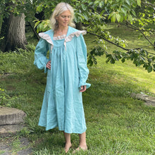 Load image into Gallery viewer, woman standing outside with teal ruffled nightgown.

