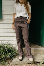 Load image into Gallery viewer, Young girl standing in front of a doorway wearing 229 Sailor Pants with 211 Two Middies, and beige shoes.
