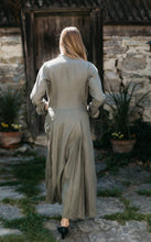 Load image into Gallery viewer, Back view of woman walking with hand in pockets wearing 230 Model T Duster

