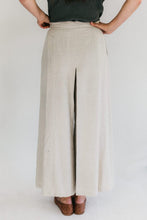 Load image into Gallery viewer, Close up of the back view a woman standing in front of a white studio backdrop with hands on her hips wearing 231 Big Sky Riding Skirt.

