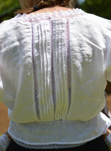 Load image into Gallery viewer, close up of back of long sleeved camisole in white with white insertion lace.
