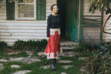 Load image into Gallery viewer, Young brunette white woman walking and smiling in front of a house surrounded by greenery wearing 243 Rodeo Cowgirl Skirt
