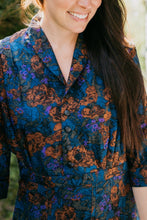Load image into Gallery viewer, Close up of woman wearing the Lindy Shirtdress buttoned looking down smiling.
