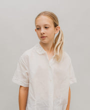 Load image into Gallery viewer, Young Blonde girl wearing The At The Hop white blouse

