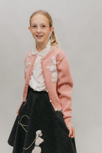 Load image into Gallery viewer, Young blonde girl smiling and standing in front of a white studio backdrop, wearing #256 At The Hop skirt, blouse and sweater.
