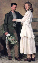 Load image into Gallery viewer, Man standing with flowers in his right hand with woman on his left  wearing a white dress and coat looking at the viewer about to button his Countryside Frock Coat.
