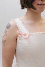Load image into Gallery viewer, Close up of the square neck Lady's Corset strap withe a pink bow ribbon at the base of the strap on white woman with dark hair and tattoo.  Ribbon tie detail for Corset top.
