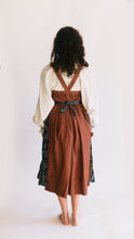 Load image into Gallery viewer, Back view of model wearing blouse, jumper, and apron all together.
