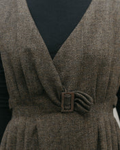 Load image into Gallery viewer, close up of the front of the jumper, plunging V-neck with pleats . Fitted waist trimmed with a purchase buckle
