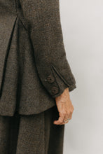 Load image into Gallery viewer, Close up of decorative button insets adorn of the cuff of the traveling jacket
