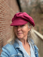 Load image into Gallery viewer, Woman wearing a red beret and denim jacket standing against a brick wall.
