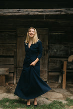 Load image into Gallery viewer, young blonde woman about standing in front of a small wooden building twirling the skirt if the 233 Glamour Girl Dress
