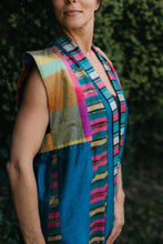Load image into Gallery viewer, Woman wearing multi colored 118 Tibetan Panel coat. Close up of shoulder and front neckline.
